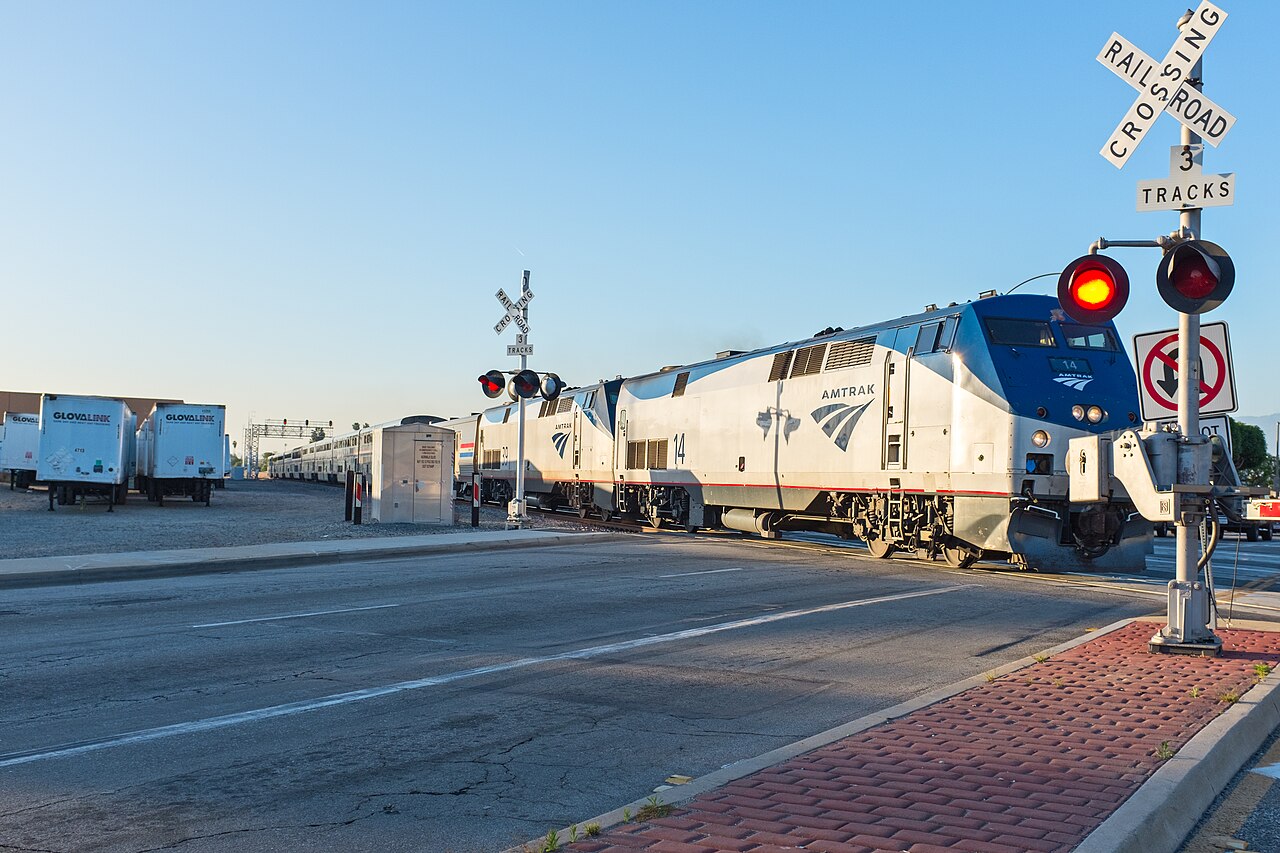 Amtrak Southwest Chief locomotive at a railway crossing in Santa Fe Springs
